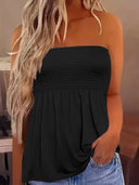 The solid-colored top is off-the-shoulder and strapless